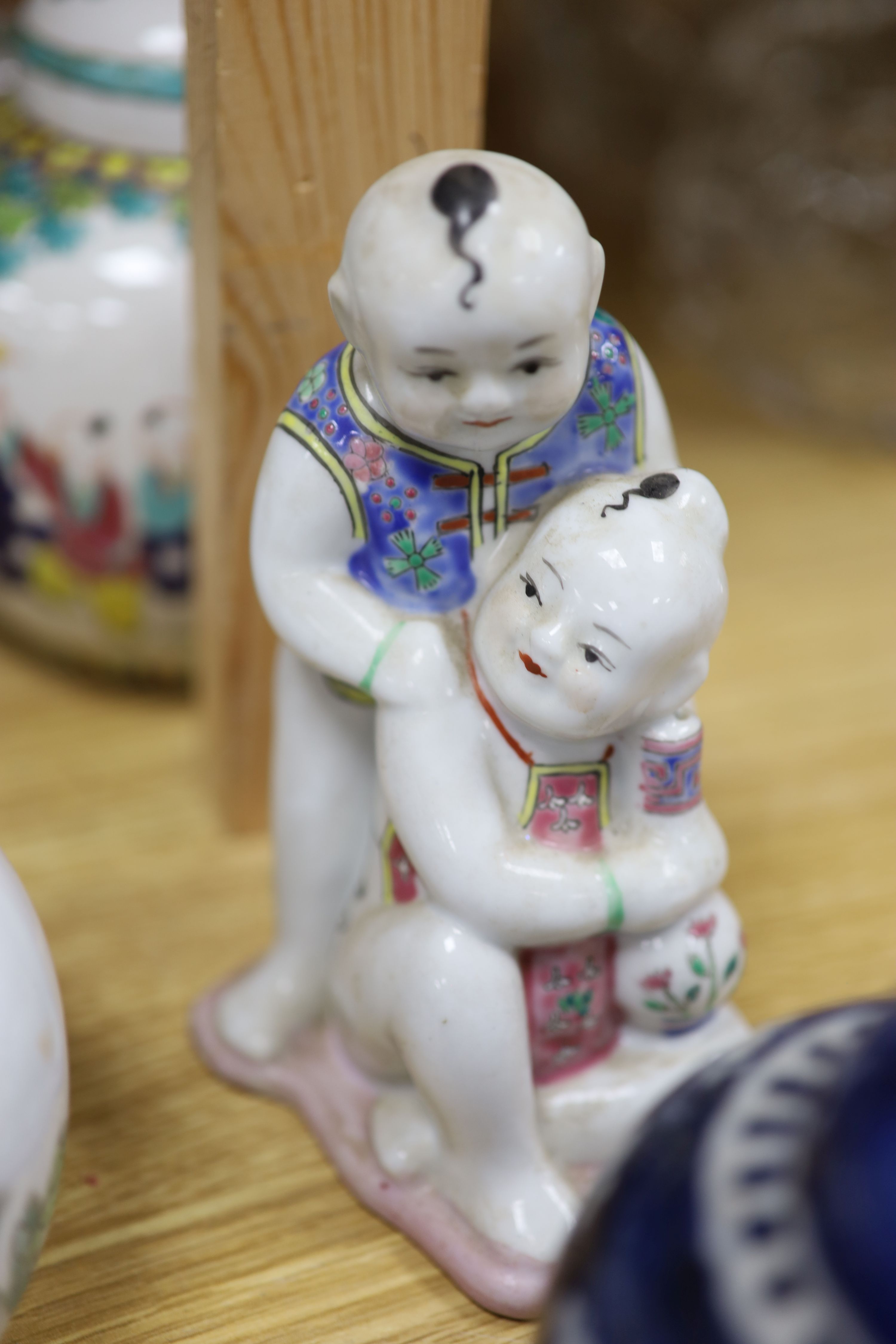 A Chinese vase, six Chinese jars and covers, a box as a basket, a jar and figure, tallest 30cm (11)